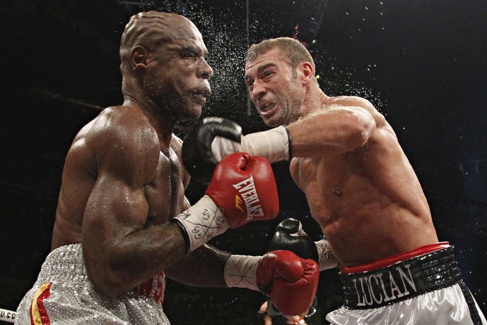 Lucian Bute of Romania punches Glen Johnson of Jamaica during their IBF Super Middleweight championship fight in Quebec City